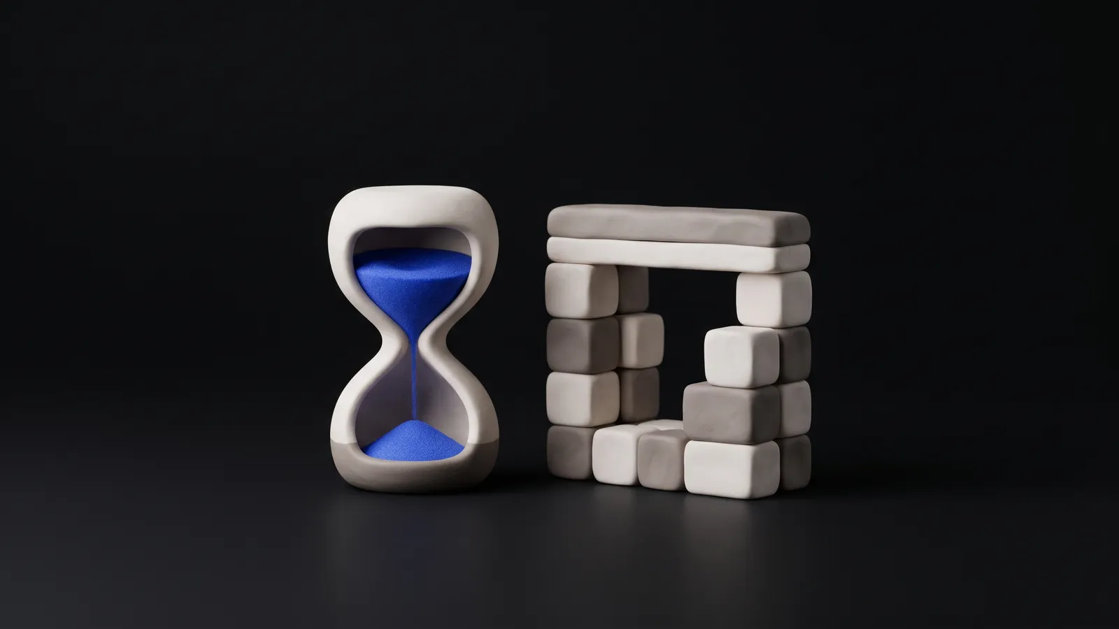 A matte clay hourglass beside a small clay browser window with a cobalt button, on a warm off-white background